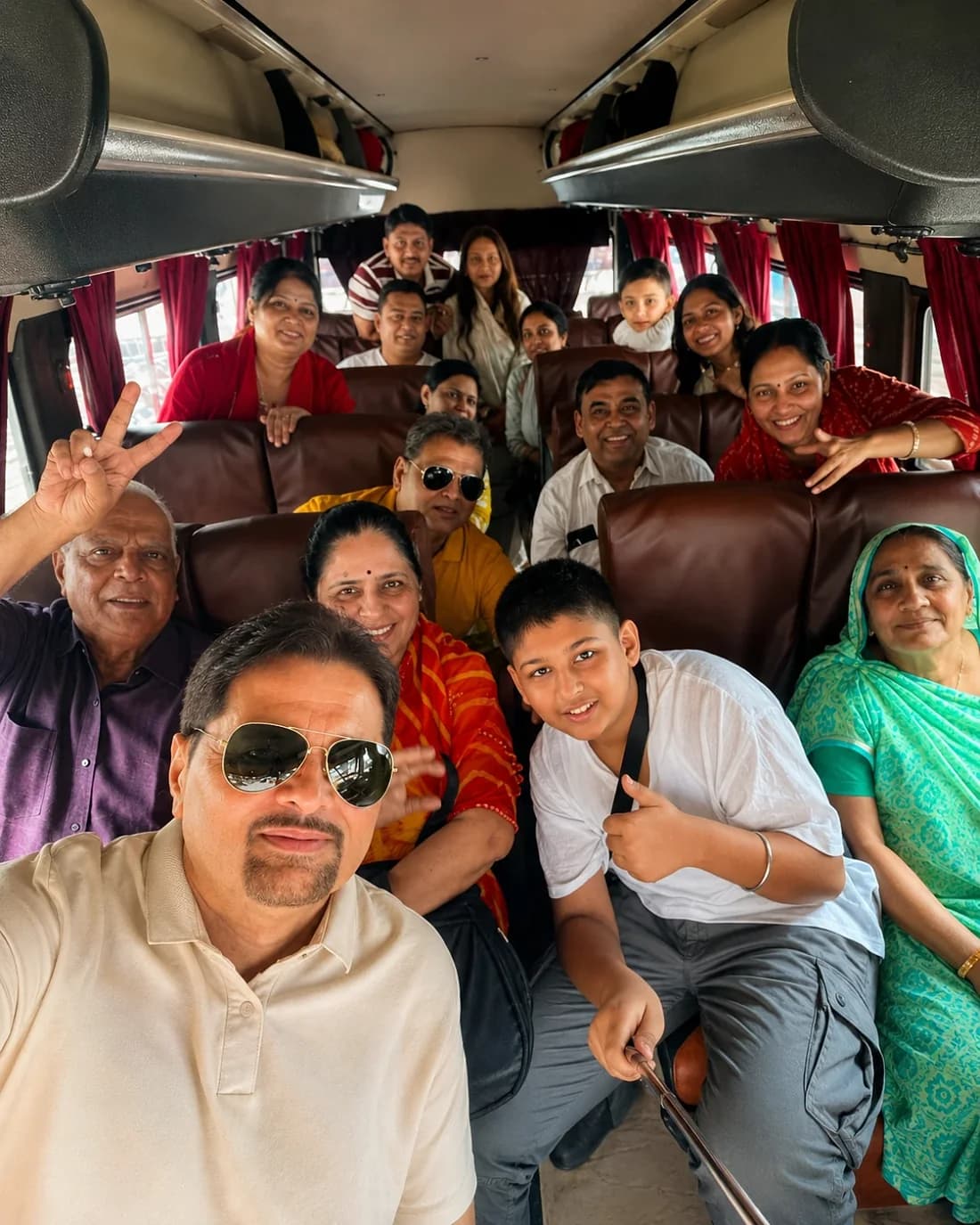 The family filling the seats of their coach, turned round for a photograph