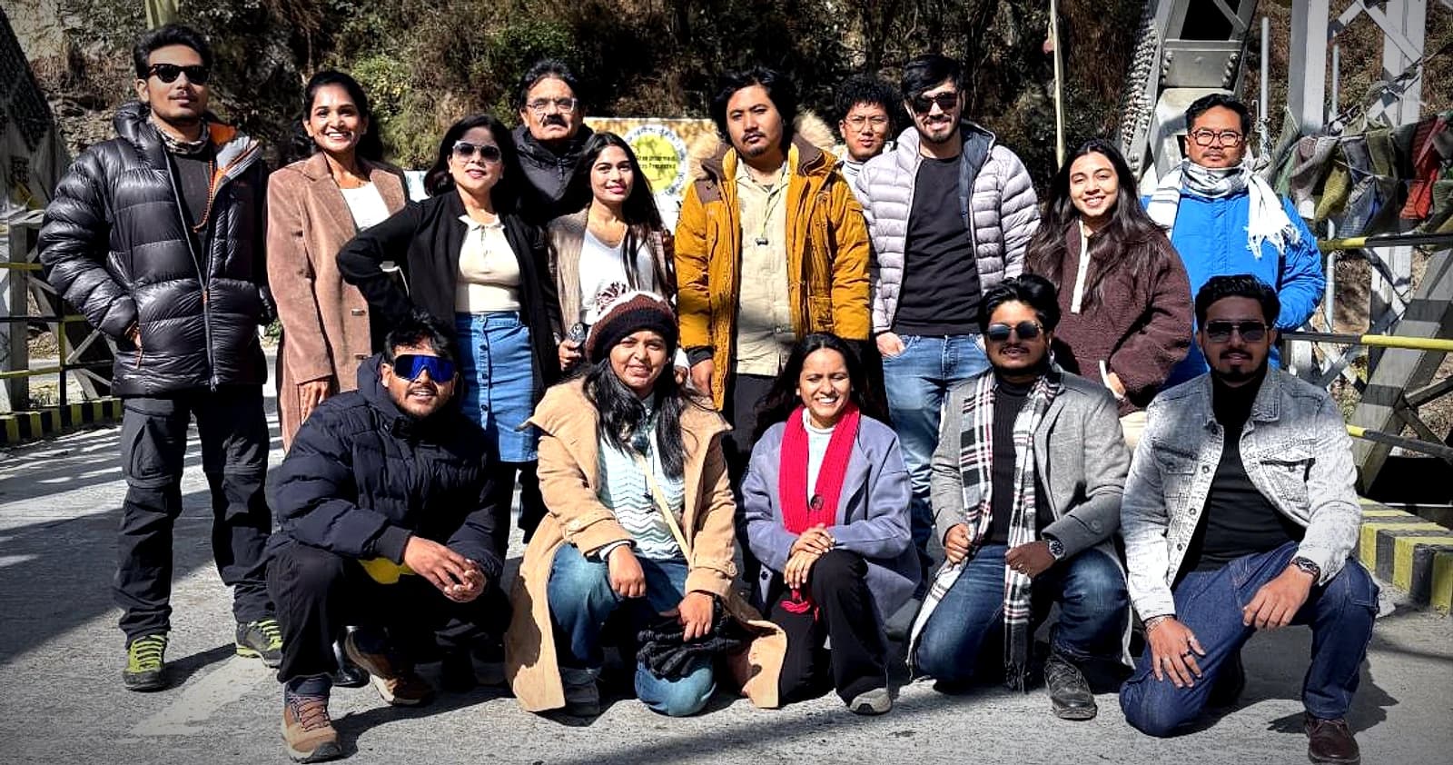 A group gathered on a river bridge in West Arunachal