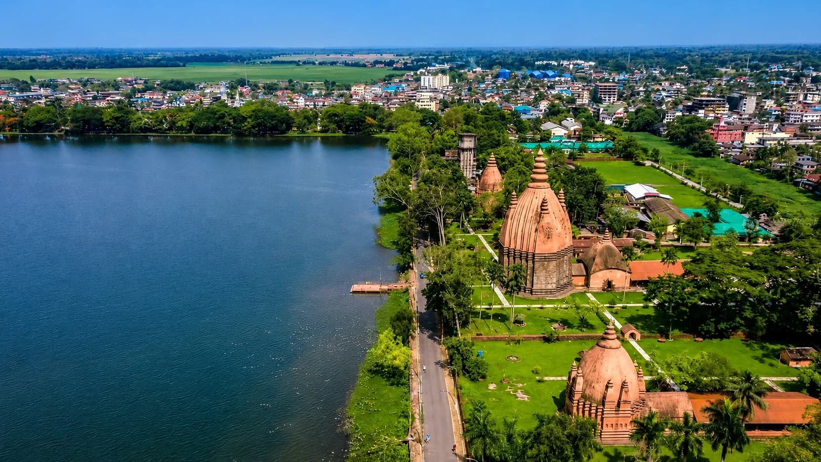 The great tank at Sivasagar seen from the air, its Ahom temple spires standing in gardens along the bank