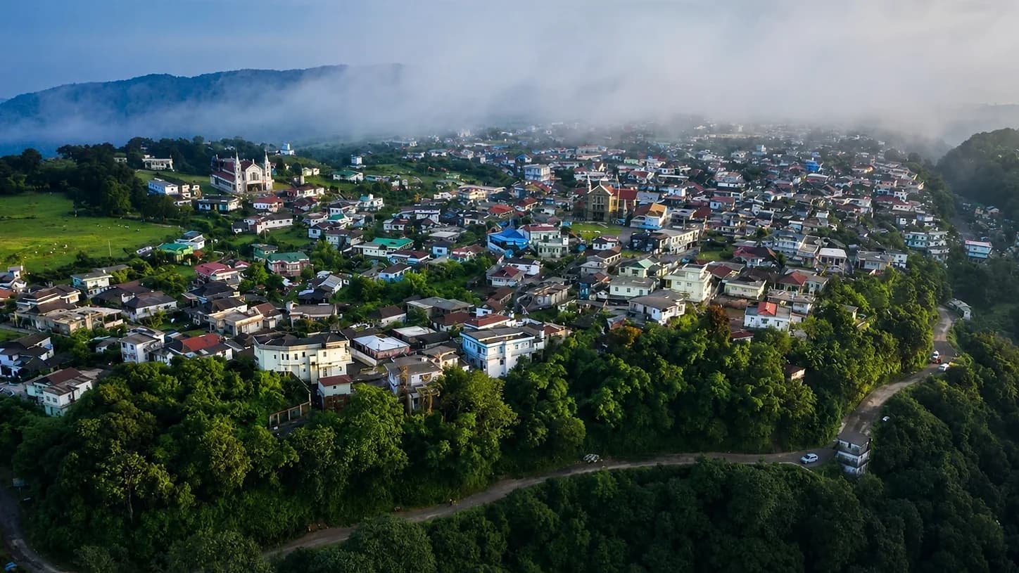 Mawsynram from above at first light, cloud rolling in off the ridge and settling over the rooftops