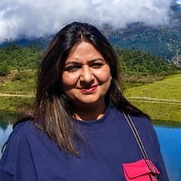 Mrs. Mridula, photographed above a lake in Arunachal Pradesh